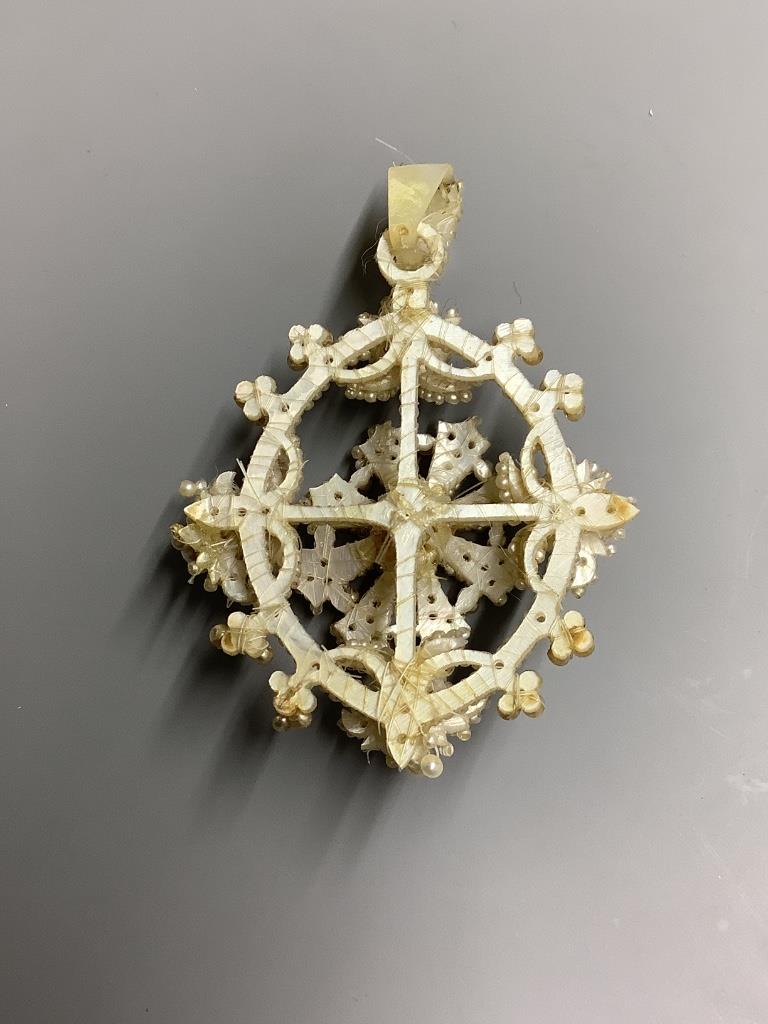 A 19th century seed pearl pendant, 55 mm, in fitted box.